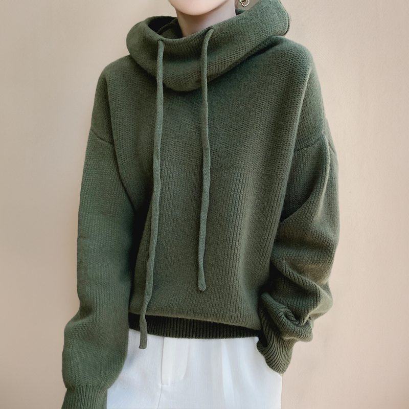 Stylowy sweter zimowy na wieszaku z zimowym tłem